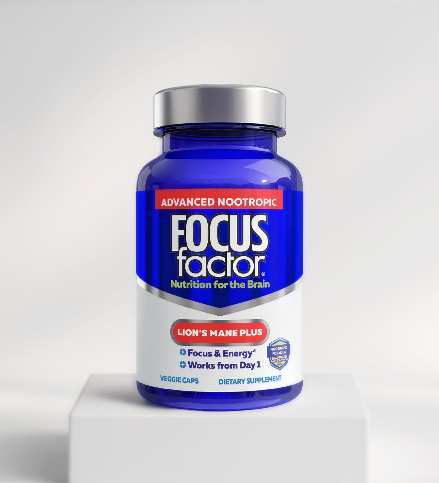 A blue bottle of Focus Factor® Lion's Mane Plus - Focus & Energy* is shown on a white pedestal with a light background. The label emphasizes 